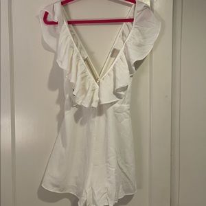 NWT White plunge front, open back ruffle romper